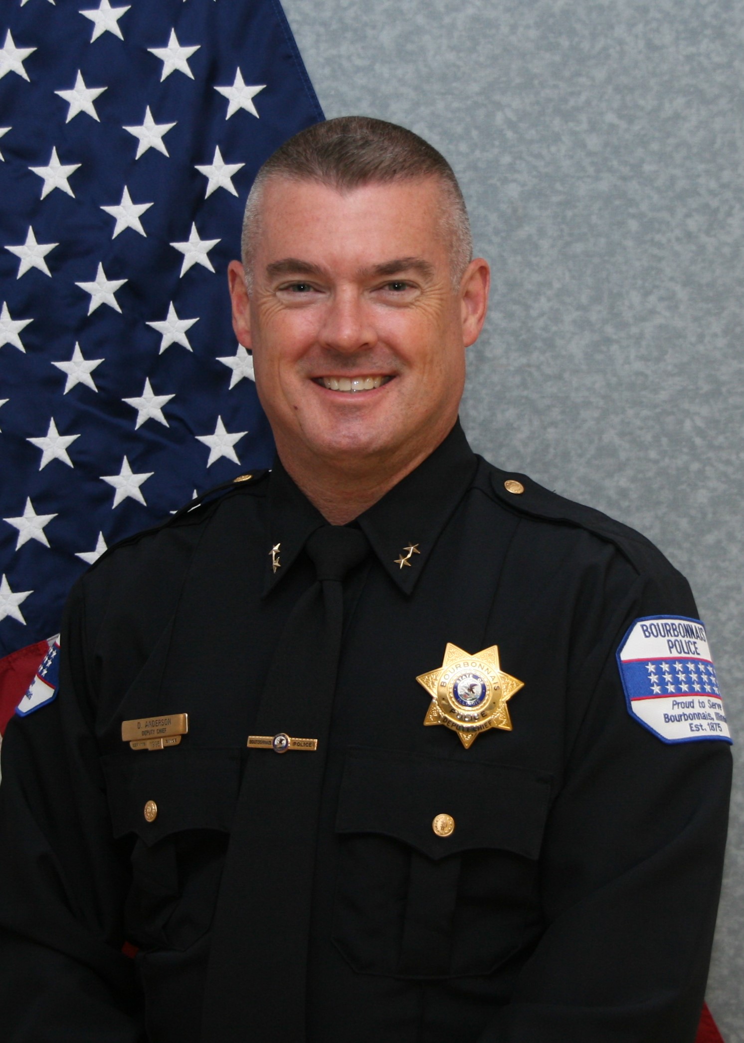 bourbonnais police officer with child during shop with a cop at target